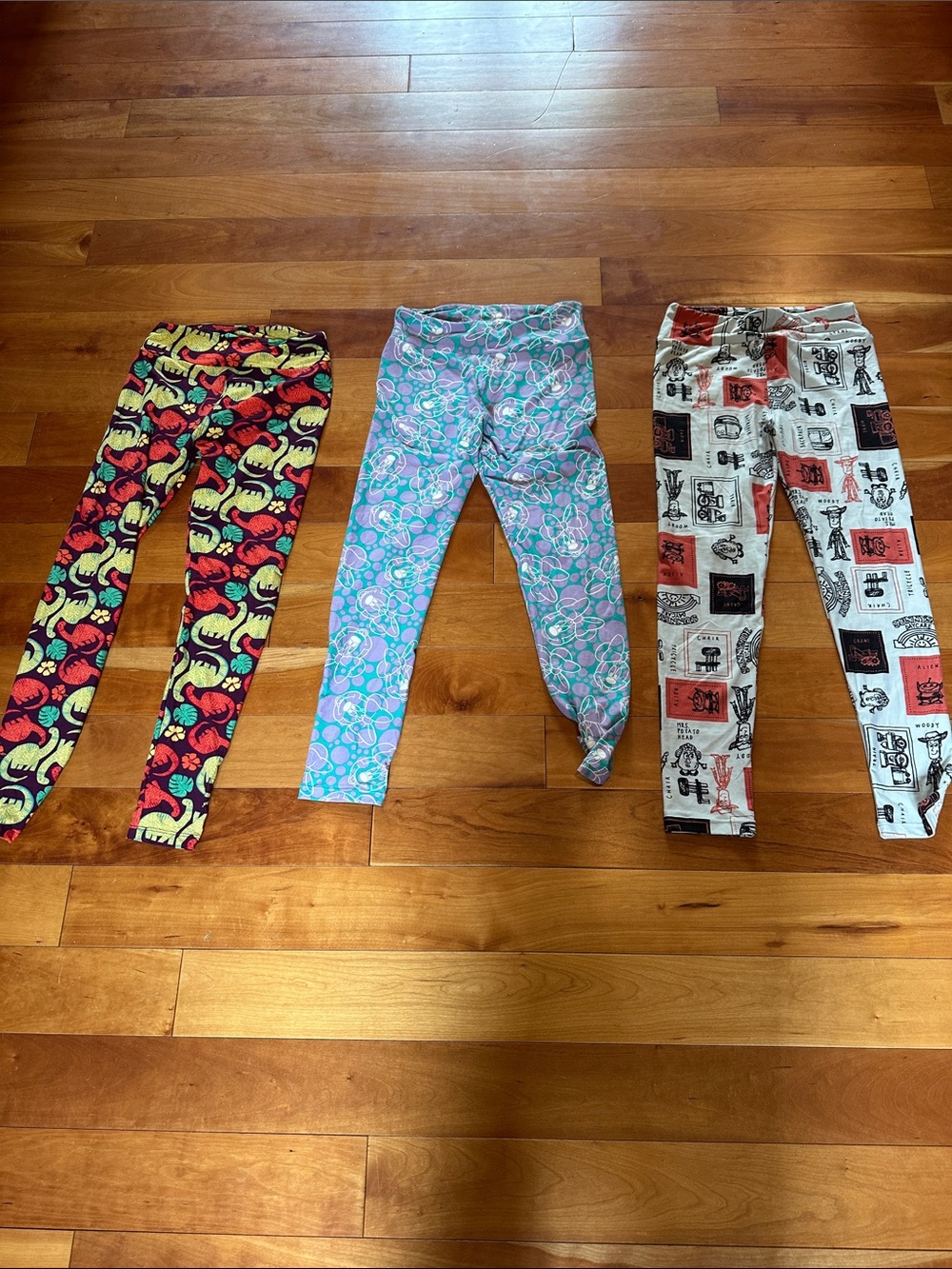 LuLaRoe Disney and dinosaur Print Leggings